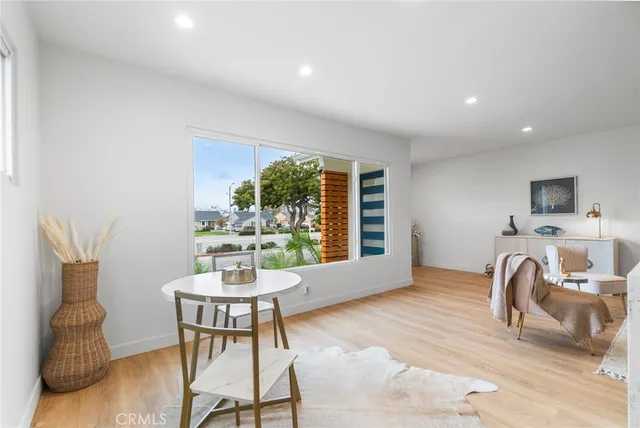 a view of a livingroom with furniture and a window