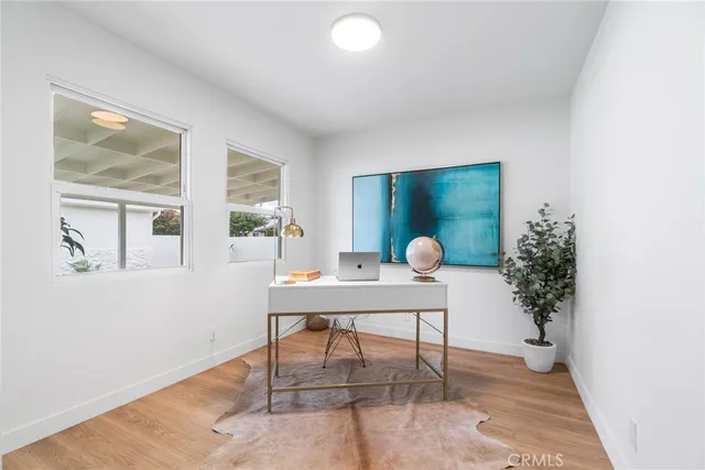 a workspace with furniture and window