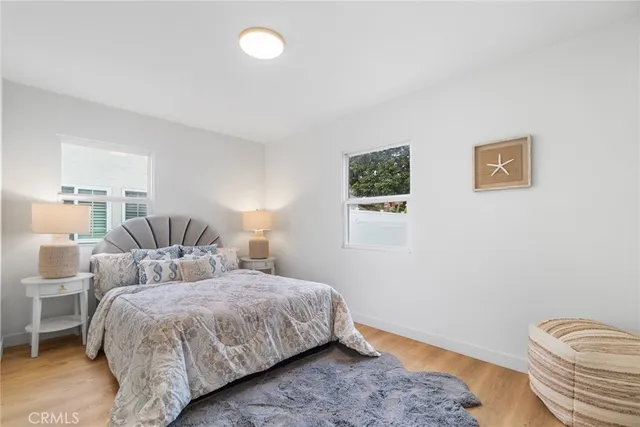 a bedroom with a bed and a lamp