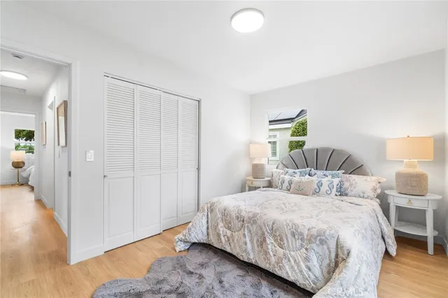 a bedroom with a bed and a lamp