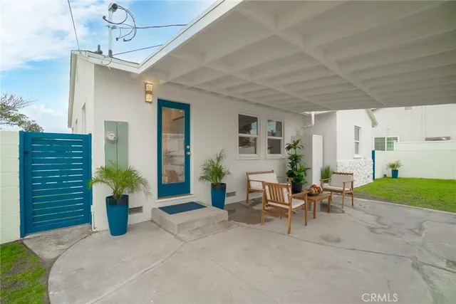 a view of a chairs and table in a patio