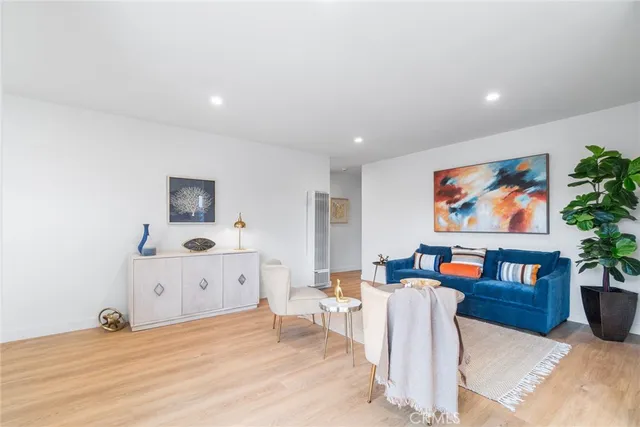 a view of a living room with furniture and a flat screen tv
