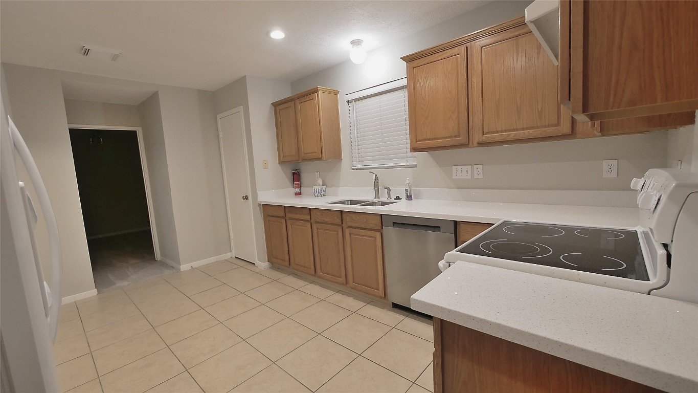 1335 Hidden Canyon Road Katy, TX 77450 - Photo 9 of 24 View of the Kitchen with the 4th bedroom behind it