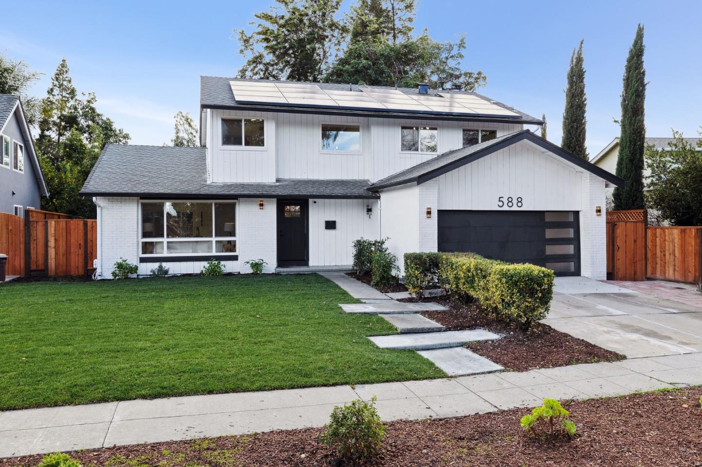 588 Lanfair Drive San Jose, CA 95136 - Photo 1 of 1 a front view of a house with a garden and yard