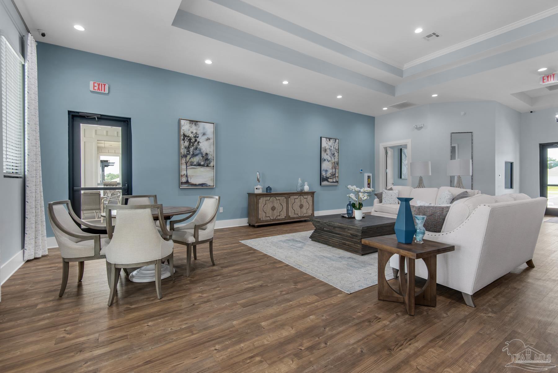 4671 Eider Road Pace, FL 32571 - Photo 27 of 37 a living room with furniture and a wooden floor