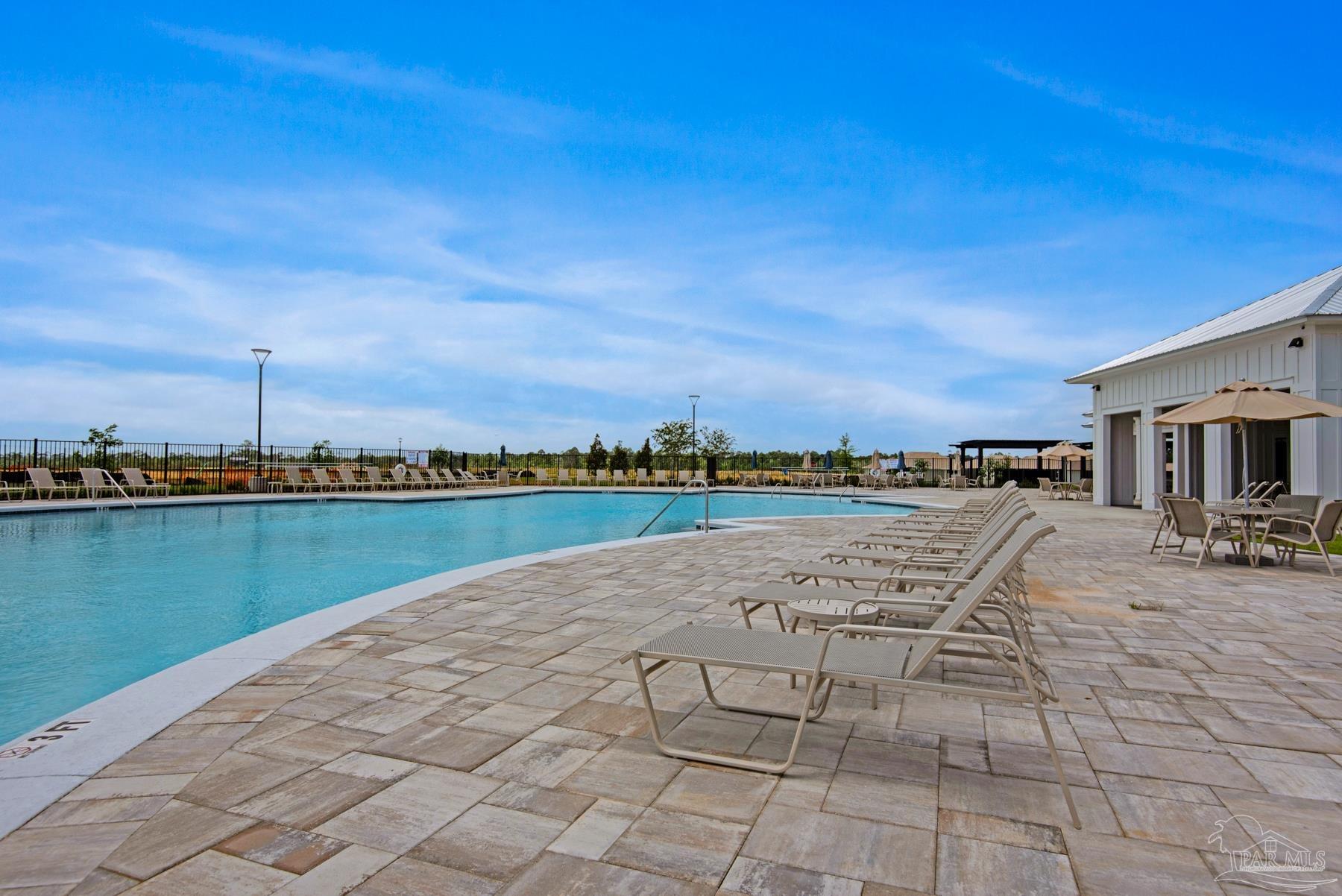 4671 Eider Road Pace, FL 32571 - Photo 37 of 37 a view of swimming pool with outdoor seating and yard