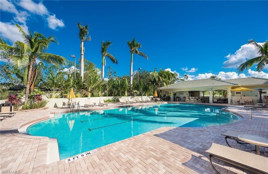 3830 Sawgrass Way, Unit 2934 Naples, FL 34112 - Photo 12 of 16 a view of a house with a yard and sitting area