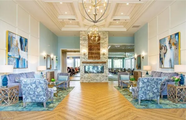 a living room with furniture chandelier and a chandelier