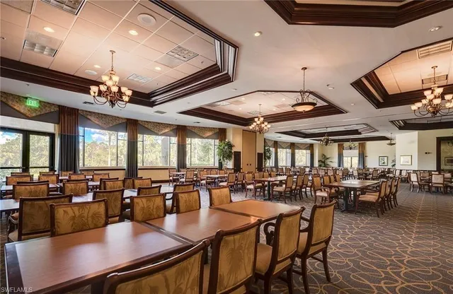 a view of a dining area with furniture window and wooden floor