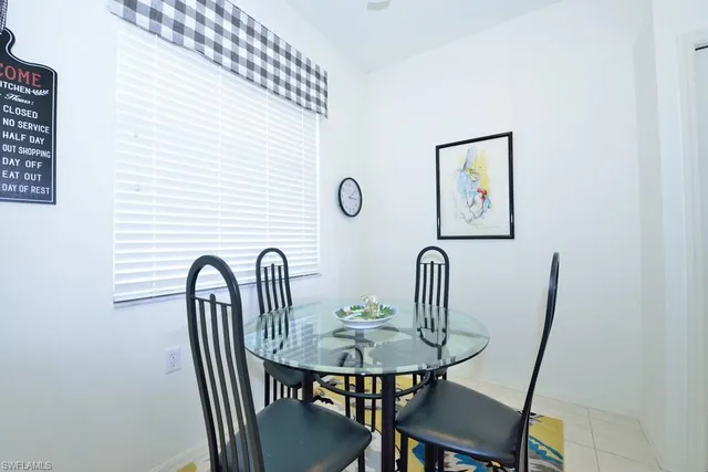 a view of a dining room with furniture and window