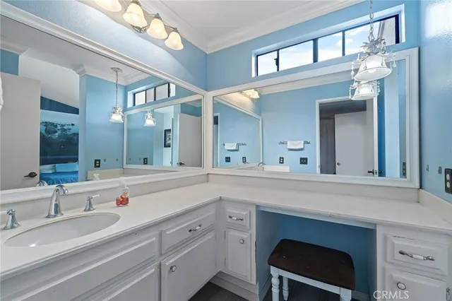 a spacious bathroom with a sink double vanity and a mirror