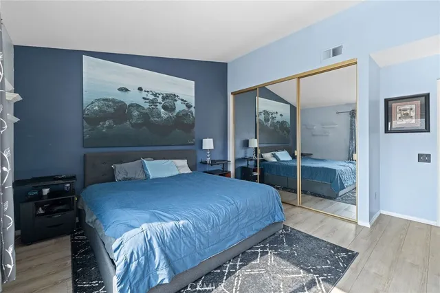 a bedroom with a bed and a walk in closet