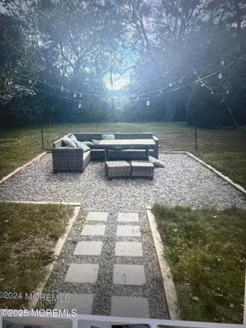 a view of a lake with sitting area