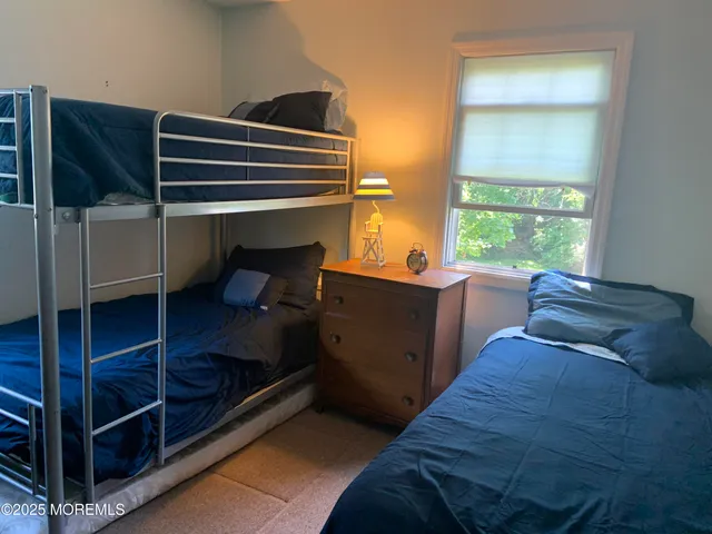 a bed room with furniture and a window