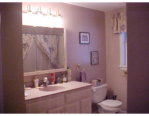 44 Fairview Park Road Sturbridge, MA 01566 - Photo 4 of 7 a bathroom with a sink mirror vanity and toilet
