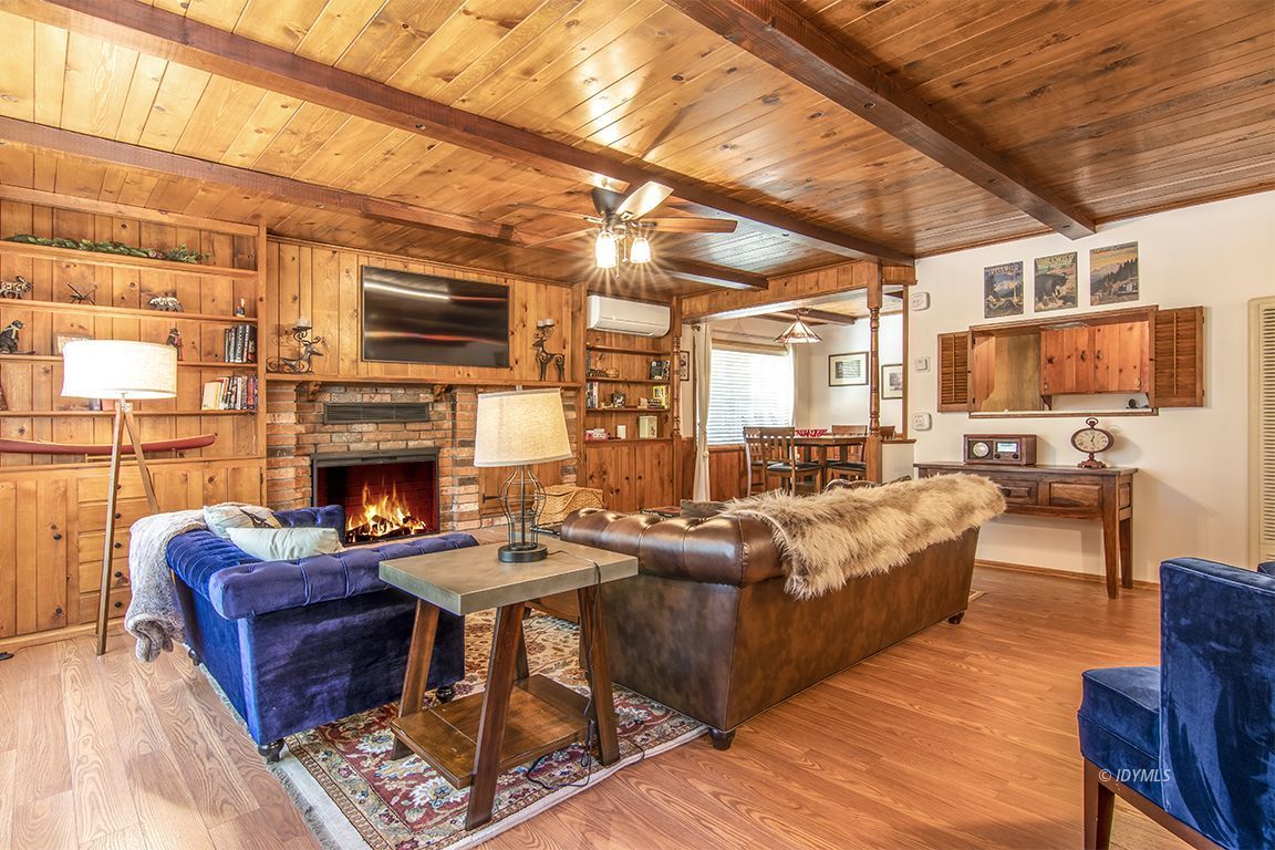 54440 Valley-View Idyllwild, CA 92549 - Photo 14 of 53 a living room with furniture a fireplace and a flat screen tv