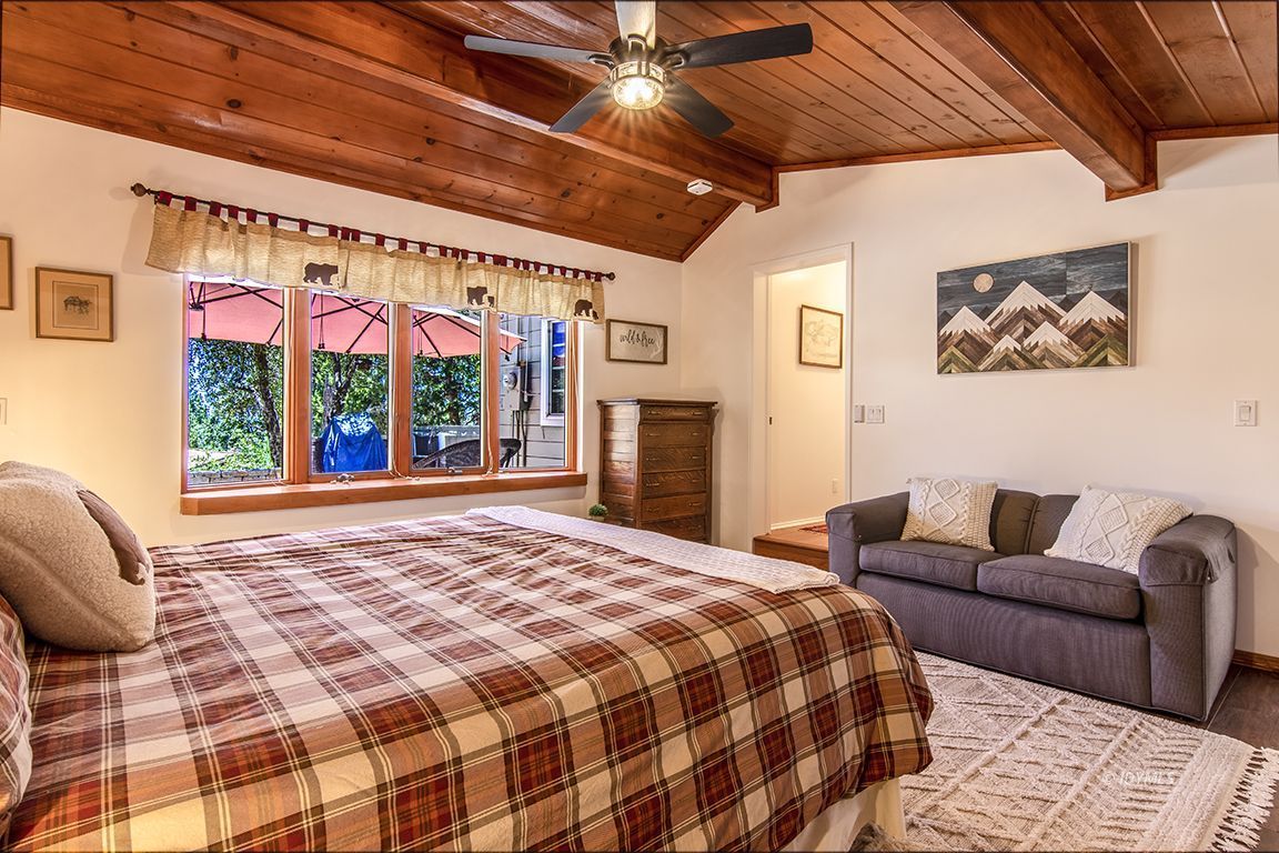 54440 Valley-View Idyllwild, CA 92549 - Photo 30 of 53 a bedroom with a large bed and a large window