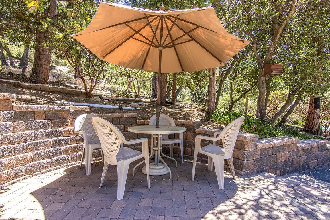 54440 Valley-View Idyllwild, CA 92549 - Photo 3 of 53 a view of a chairs and table under an umbrella