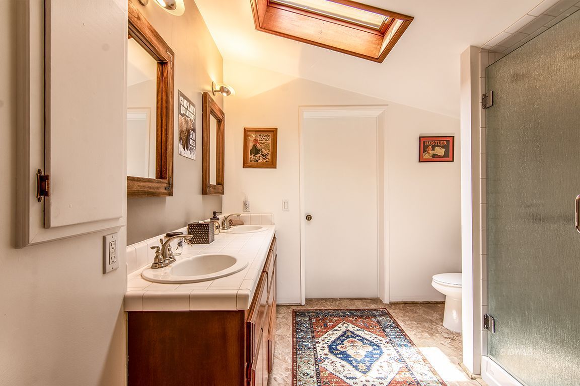 54440 Valley-View Idyllwild, CA 92549 - Photo 35 of 53 a bathroom with a sink and a mirror