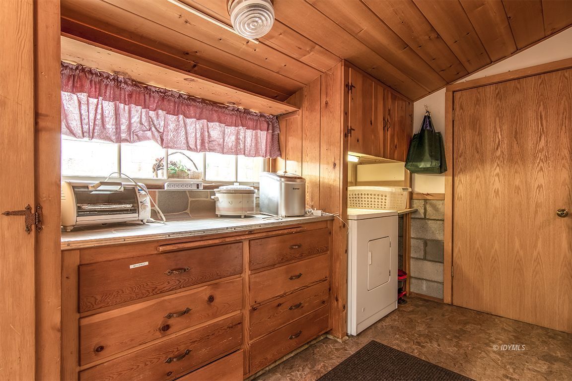 54440 Valley-View Idyllwild, CA 92549 - Photo 41 of 53 a kitchen with a refrigerator and window