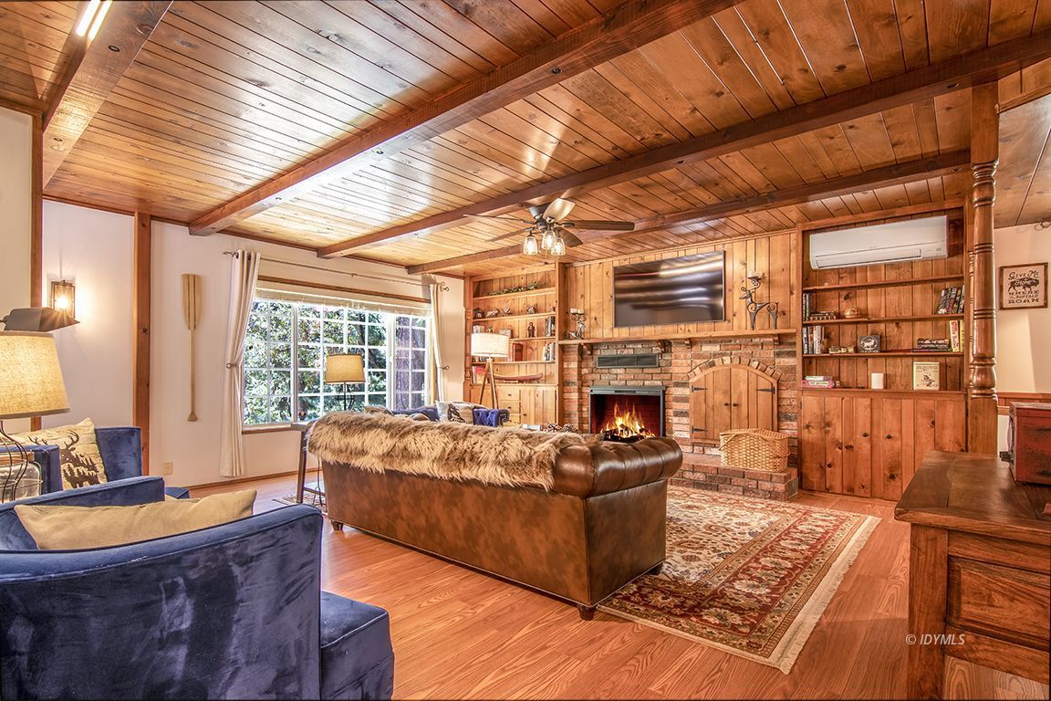 54440 Valley-View Idyllwild, CA 92549 - Photo 9 of 53 a living room with fireplace furniture and a large window