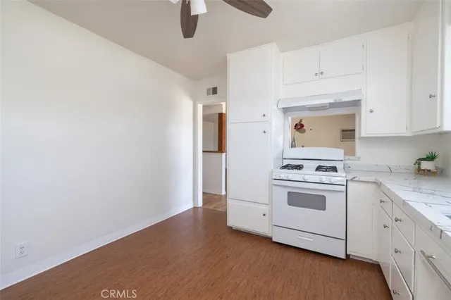 a view of a bathroom with wooden floor