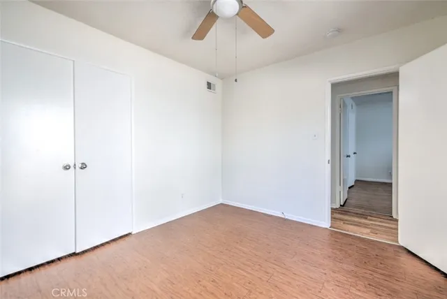 a view of a patio with couches table and chairs with a swimming pool
