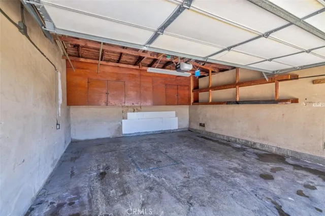a view of a backyard with plants and a patio
