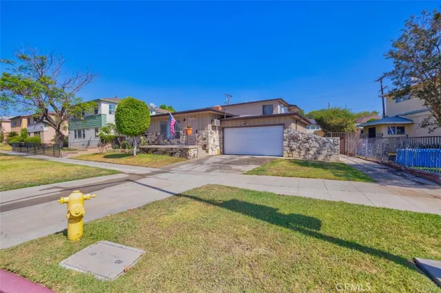 a kitchen with stainless steel appliances granite countertop a stove and a refrigerator