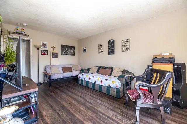 a bedroom with bed and a couch