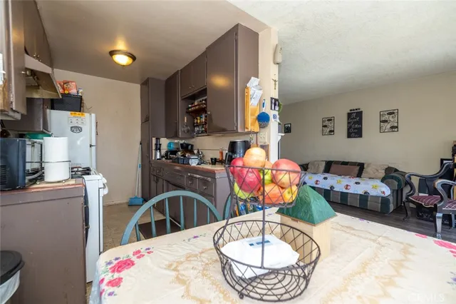 a bedroom with a large bed and a dresser