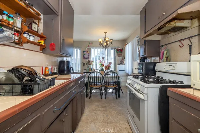 a living room with lots of furniture and wooden floor