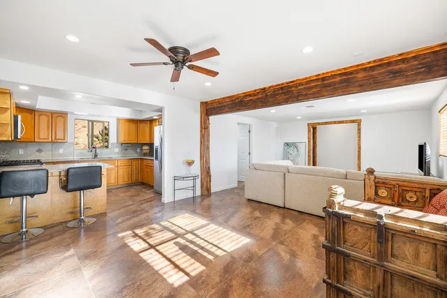 a kitchen with a counter space a sink appliances and cabinets