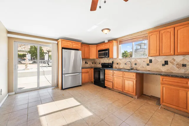 a view of a kitchen with a sink and cabinets