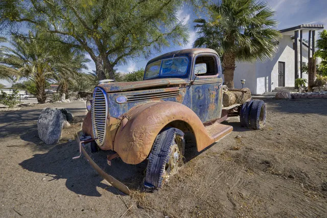 a view of a backyard with a sink and plants