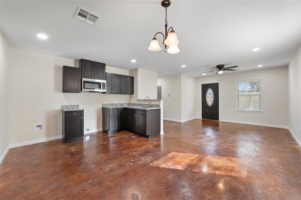 1126 North 11th Street Waco, TX 76707 - Photo 14 of 22 a view of a kitchen with a sink and a refrigerator