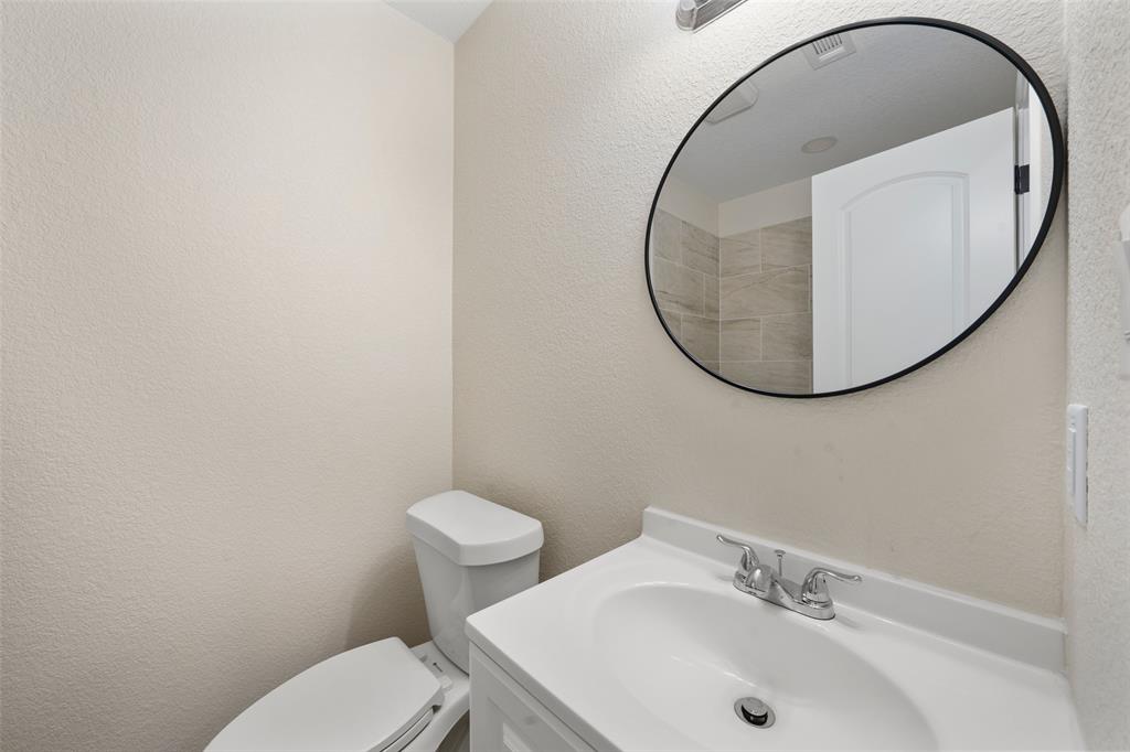 1126 North 11th Street Waco, TX 76707 - Photo 16 of 22 a bathroom with a sink and a mirror