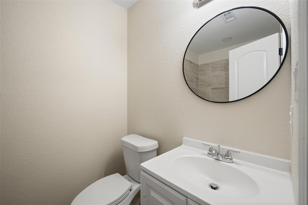 1126 North 11th Street Waco, TX 76707 - Photo 18 of 22 a bathroom with a sink and a mirror
