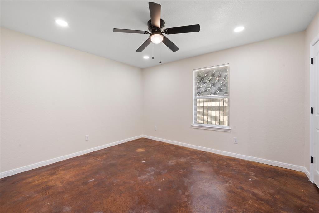 1126 North 11th Street Waco, TX 76707 - Photo 19 of 22 an empty room with a window and a fan