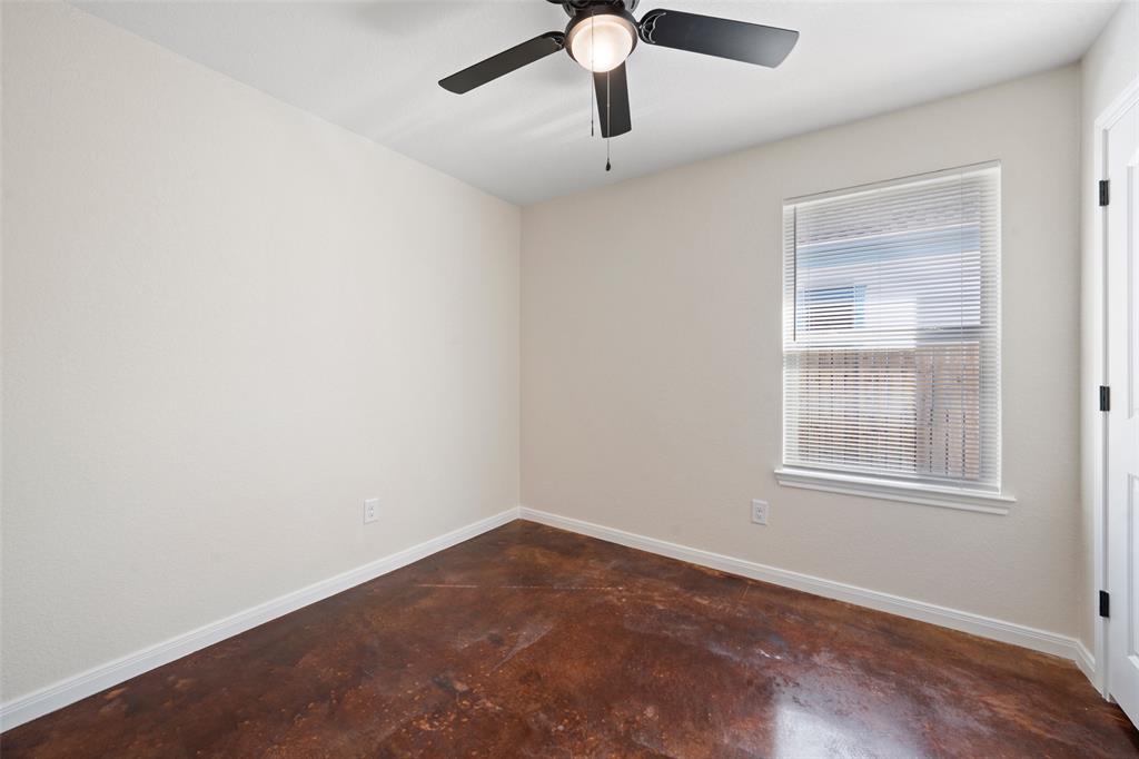 1126 North 11th Street Waco, TX 76707 - Photo 6 of 22 an empty room with a window and a ceiling fan