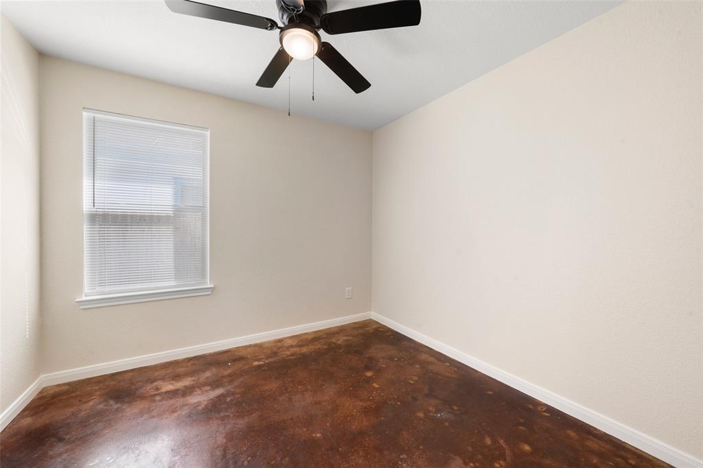 1126 North 11th Street Waco, TX 76707 - Photo 8 of 22 an empty room with windows and fan