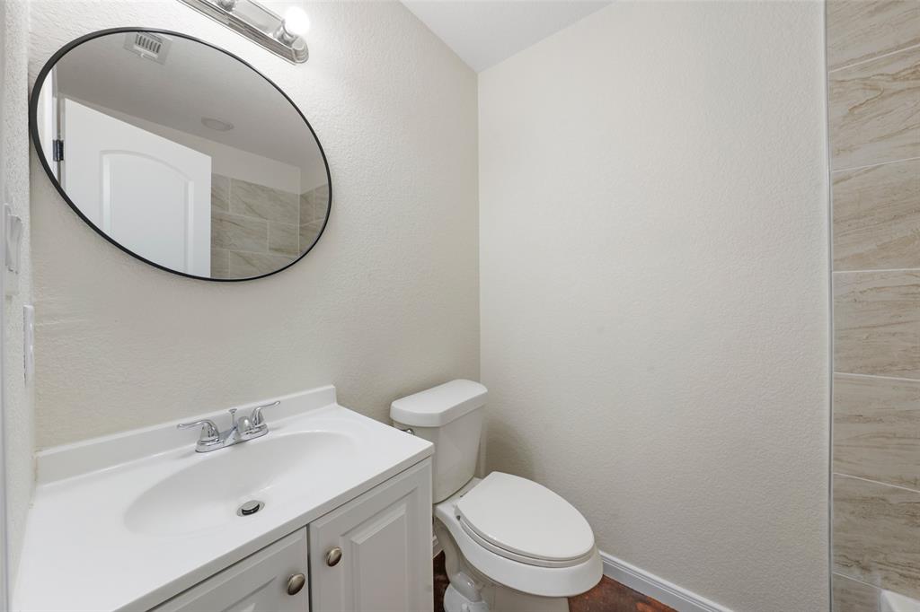 1126 North 11th Street Waco, TX 76707 - Photo 9 of 22 a bathroom with a sink and a mirror