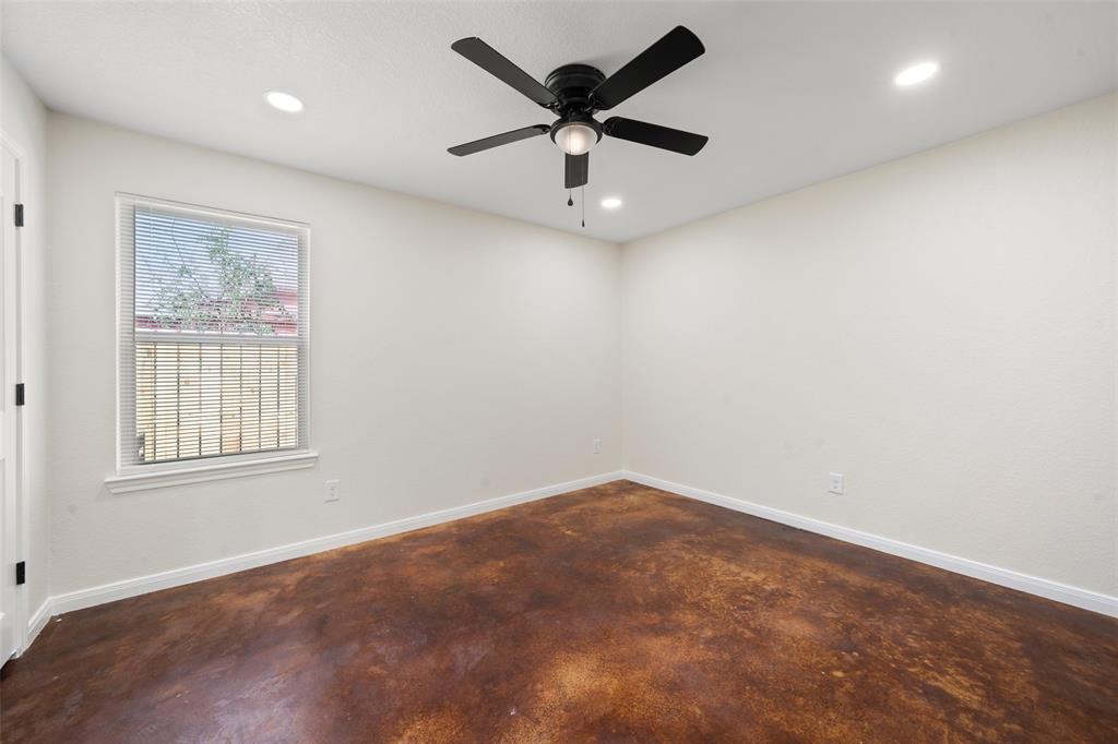 1126 North 11th Street Waco, TX 76707 - Photo 10 of 22 an empty room with a window and a fan