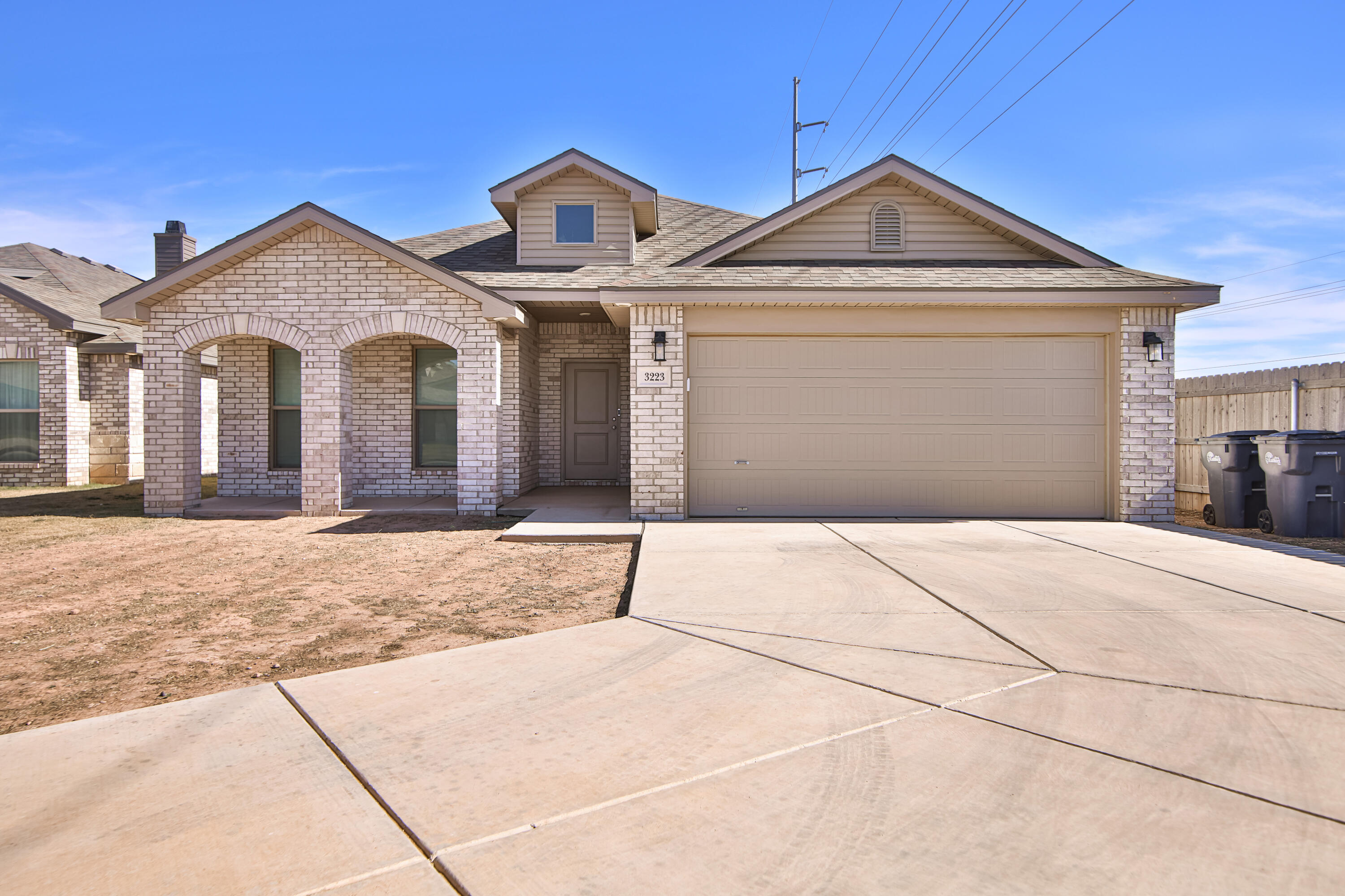 3223 Volney Avenue Lubbock, TX 79407 - Photo 1 of 29 a front view of a house with a yard