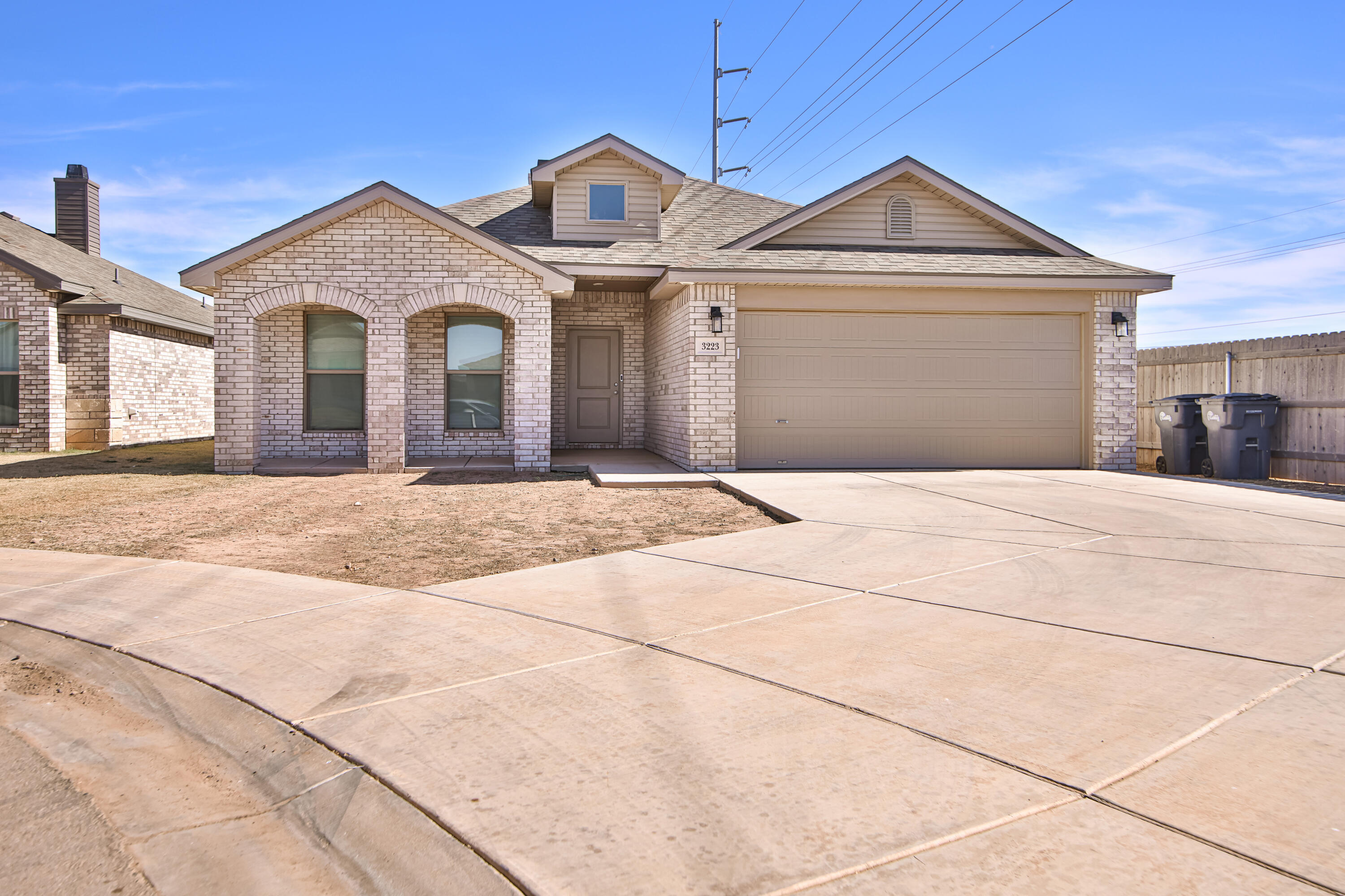 3223 Volney Avenue Lubbock, TX 79407 - Photo 2 of 29 a front view of a house with a yard