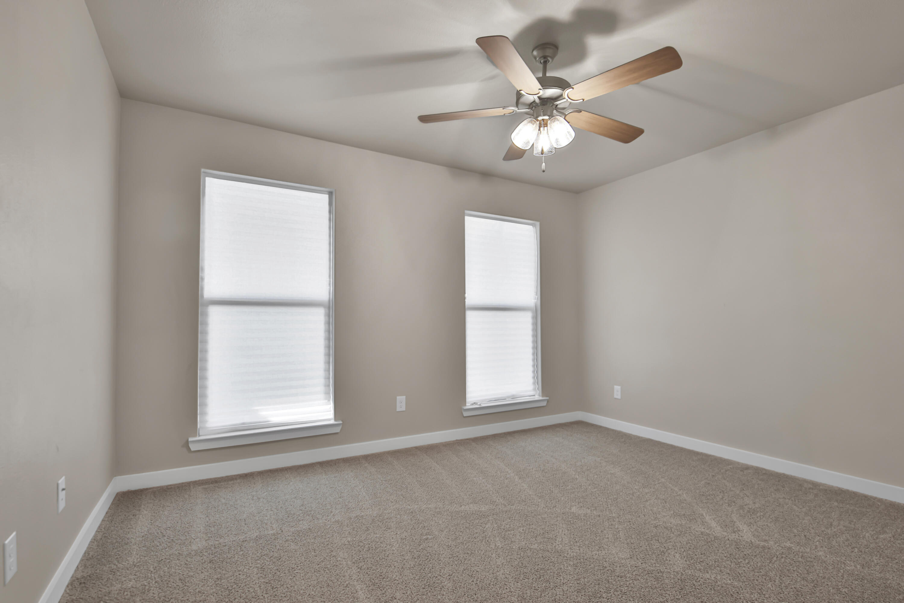 3223 Volney Avenue Lubbock, TX 79407 - Photo 21 of 29 an empty room with window and ceiling fan