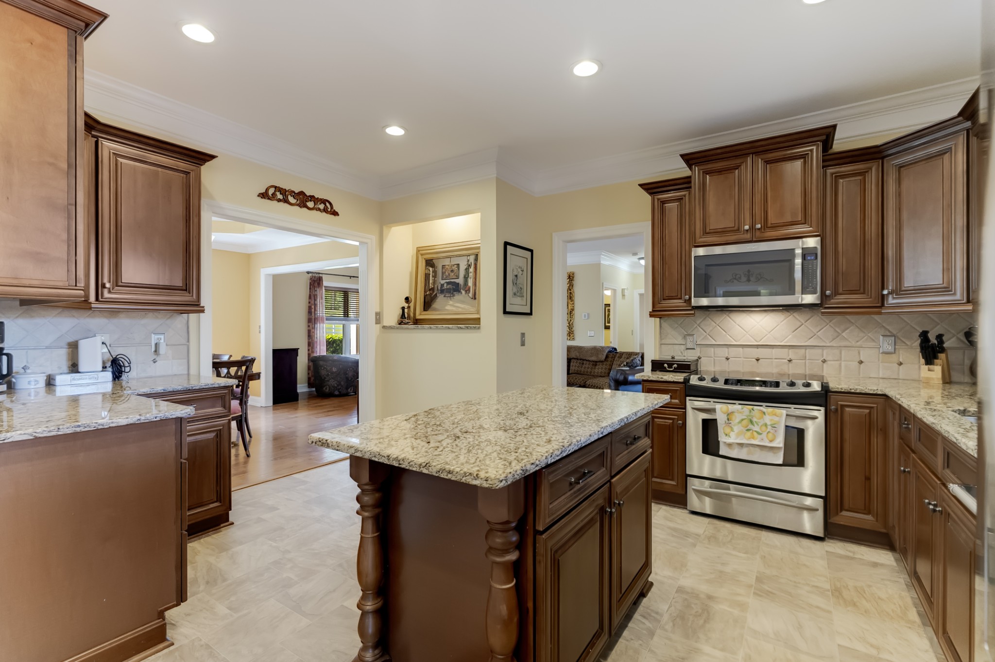 1446 Kittrell Road Franklin, TN 37064 - Photo 14 of 71 a kitchen with granite countertop a sink stove and refrigerator
