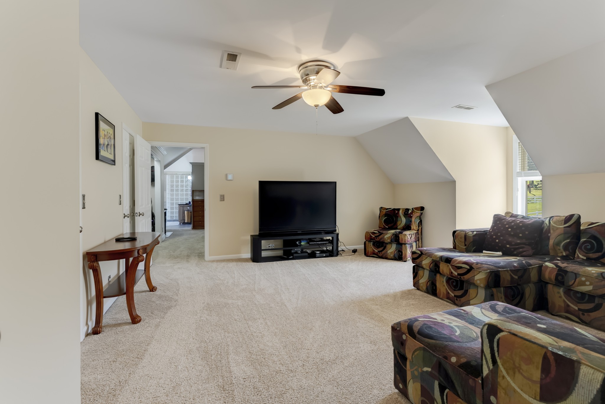 1446 Kittrell Road Franklin, TN 37064 - Photo 32 of 71 a living room with furniture a flat screen tv and a fireplace