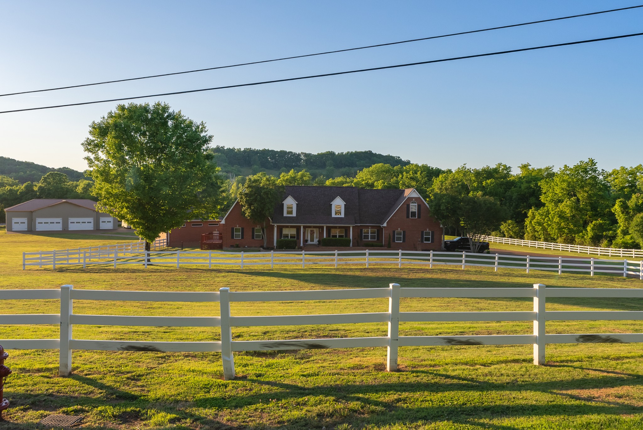 1446 Kittrell Road Franklin, TN 37064 - Photo 54 of 71 a view of a swimming pool with a lawn chairs under an umbrella