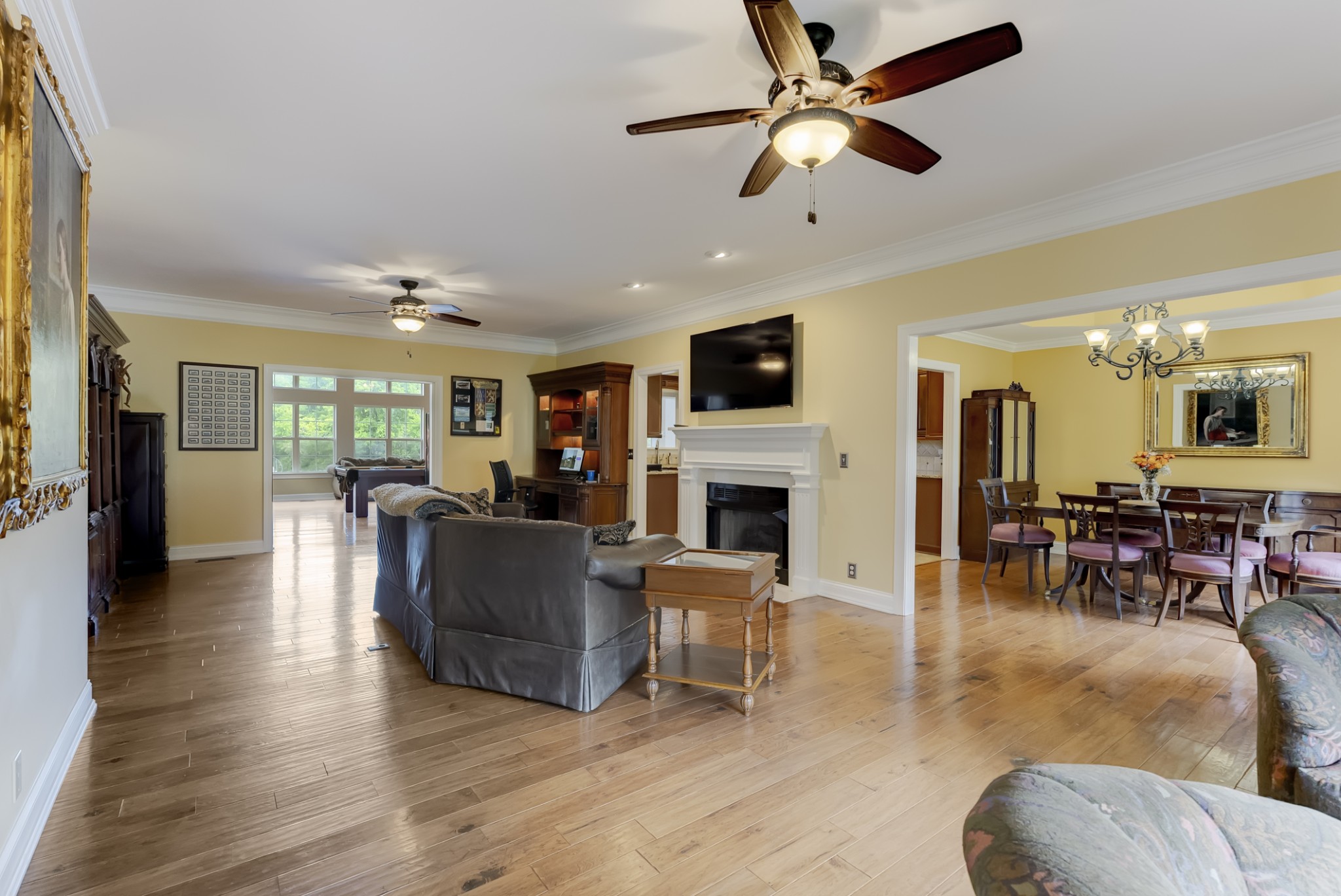 1446 Kittrell Road Franklin, TN 37064 - Photo 9 of 71 a living room with furniture a fireplace and a flat screen tv
